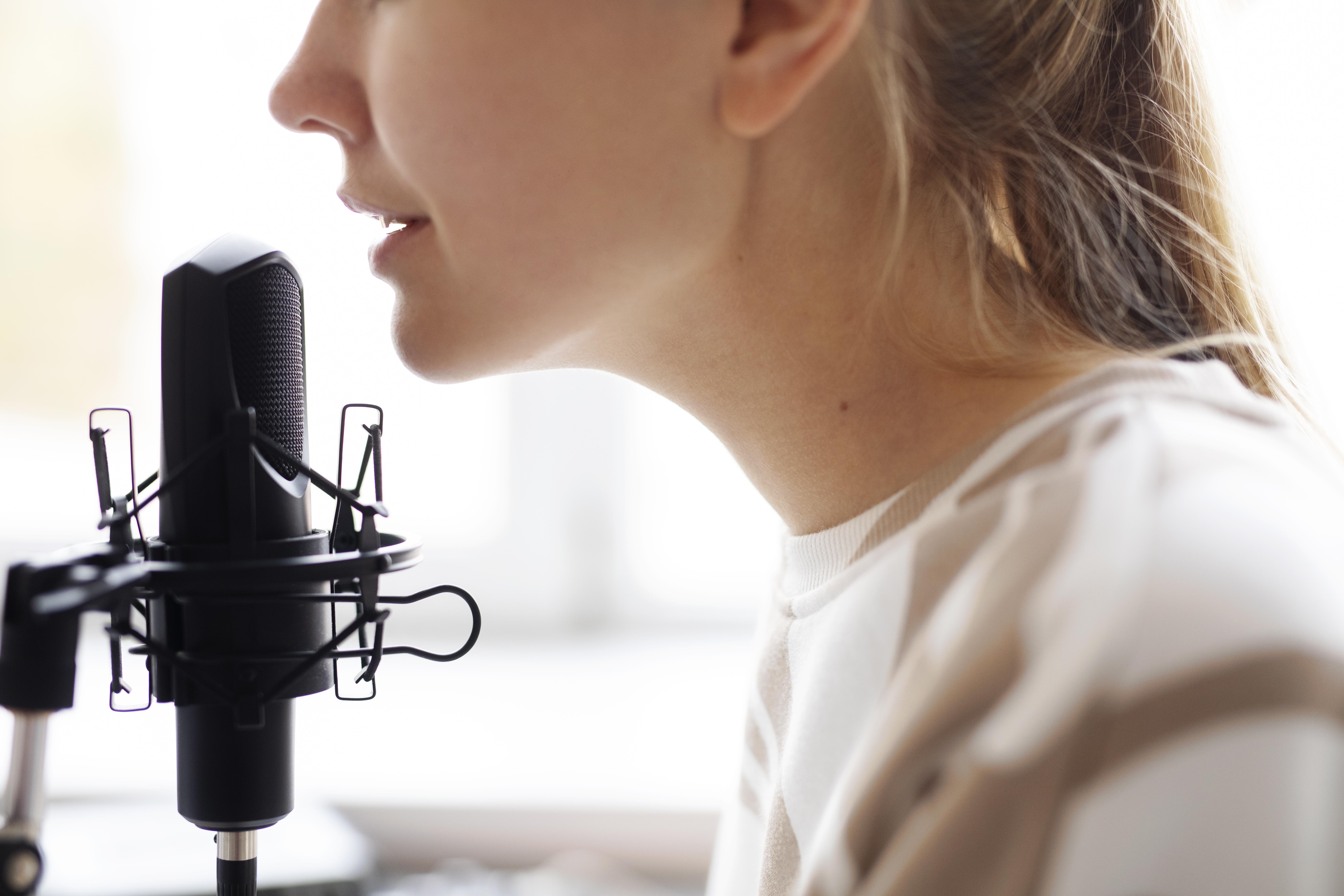 close up woman with microphone