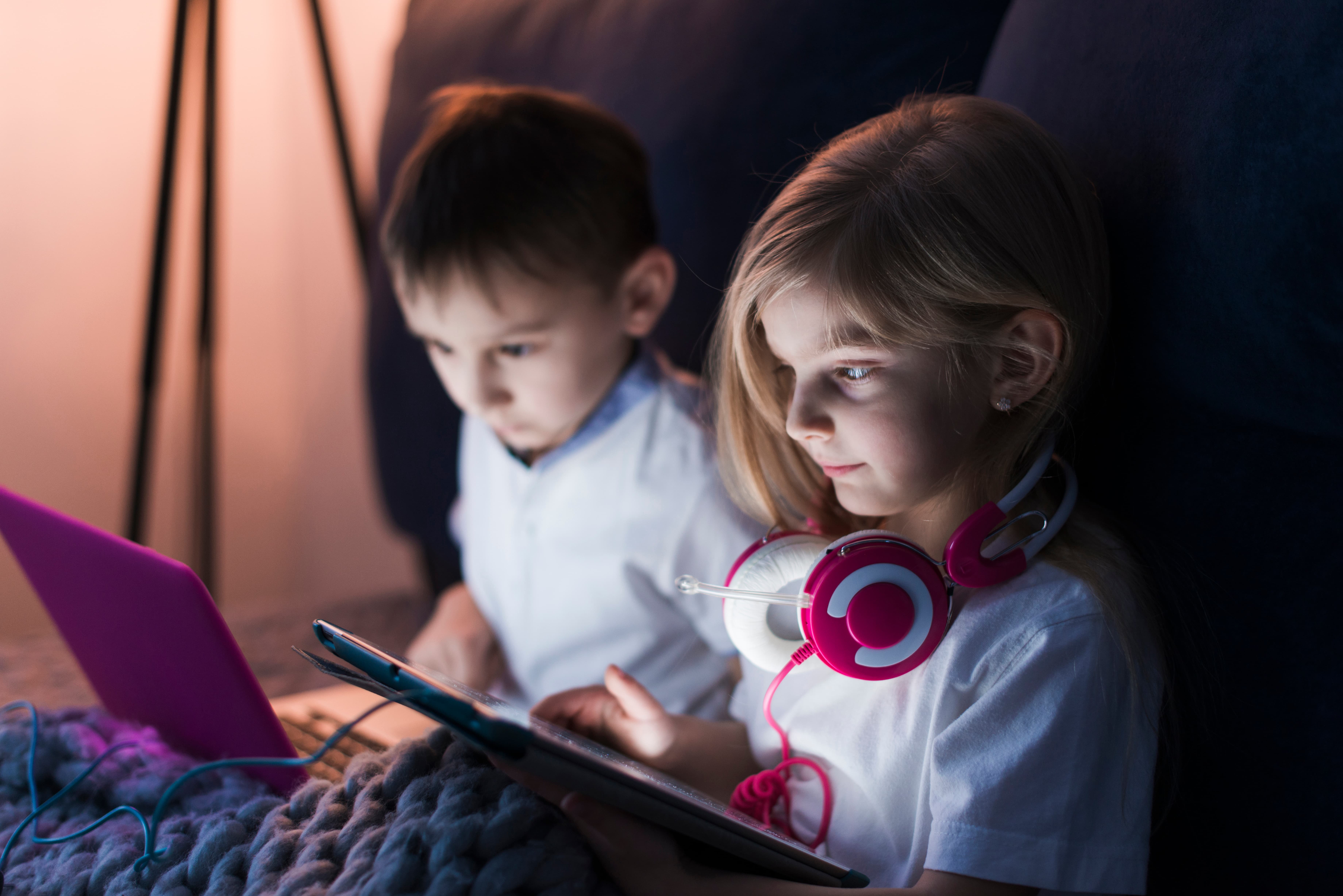 kids looking tablet laptop 1